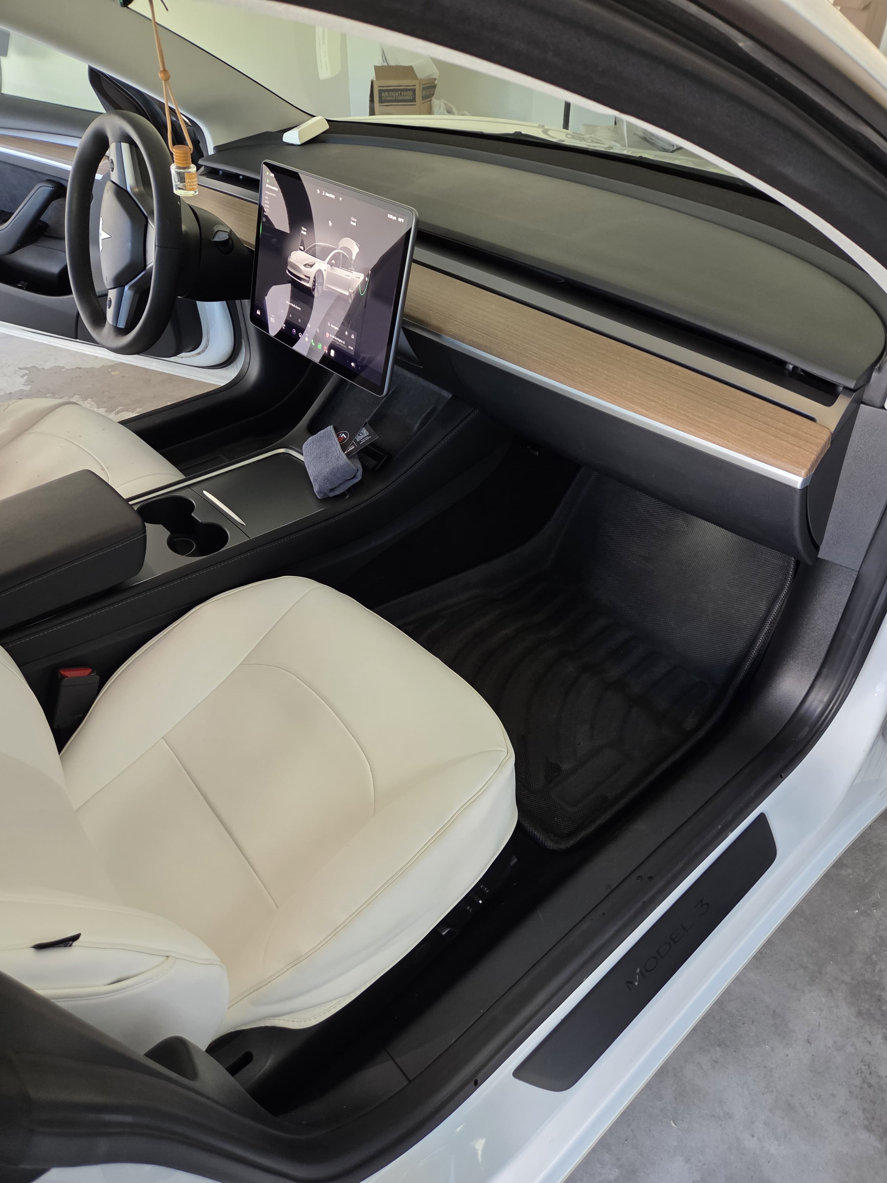 Tesla footwell and door trim after detailing