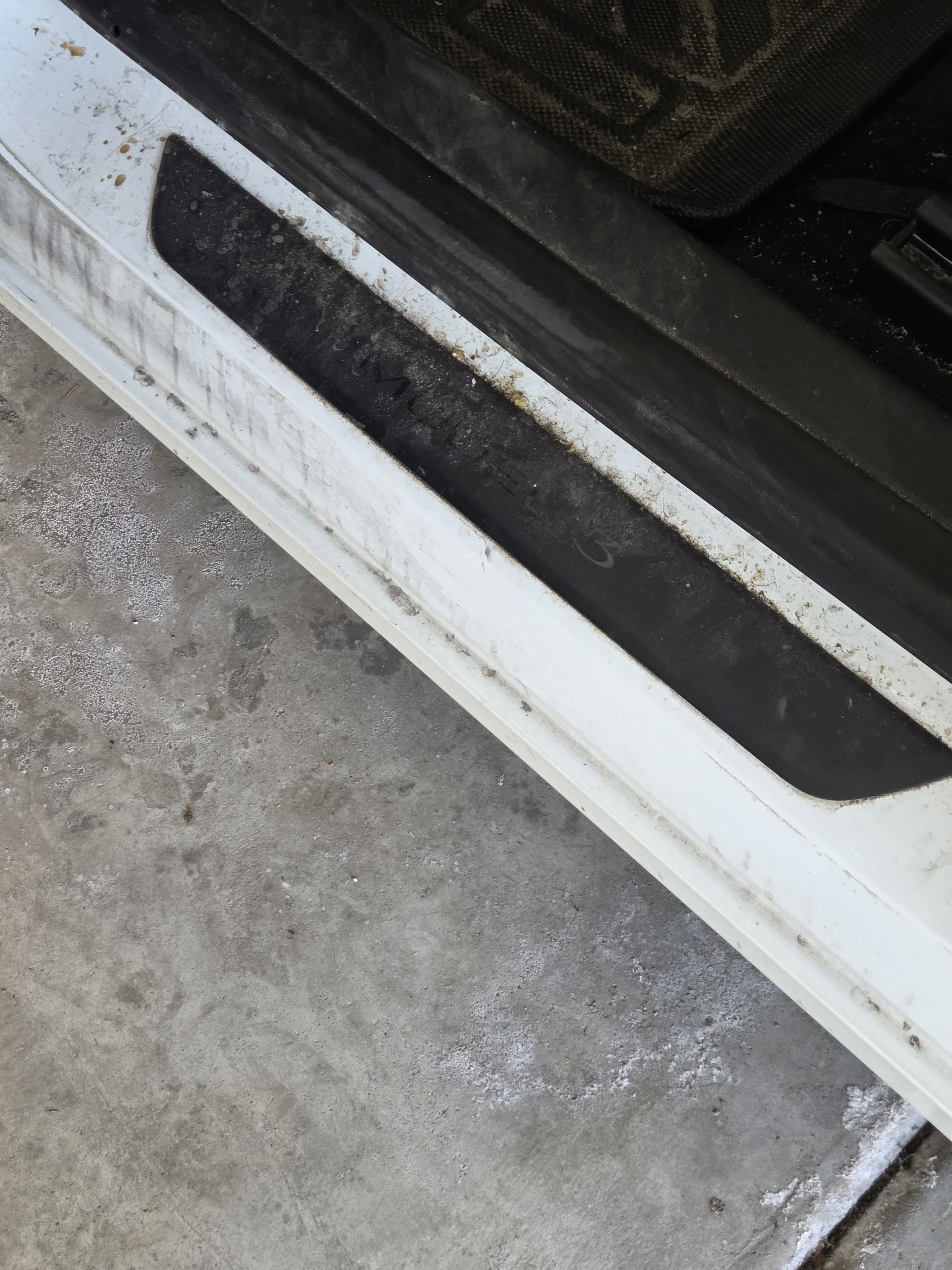 Tesla footwell and door trim before detailing